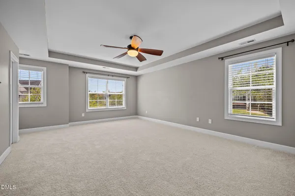a living room with furniture a rug and a flat screen tv