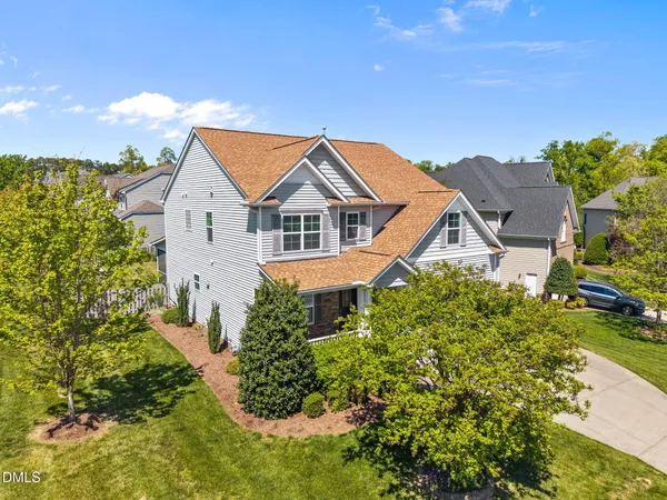a kitchen with stainless steel appliances granite countertop a refrigerator a stove and a sink