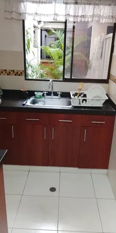 a bedroom with a bed and cabinets