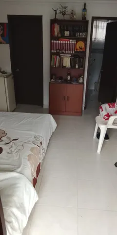 a view of living room with furniture and a window