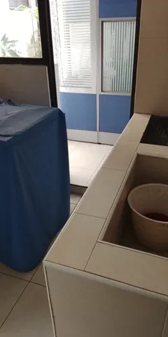 a living room with furniture tv and a window