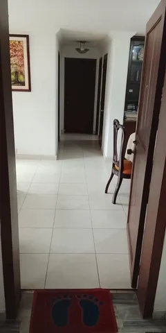 a view of a city street with tall buildings