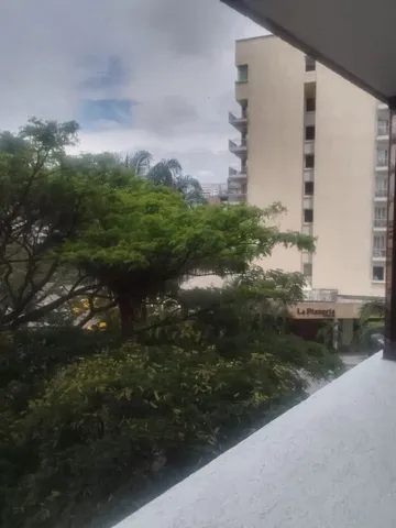 a view of a lake with a building in background