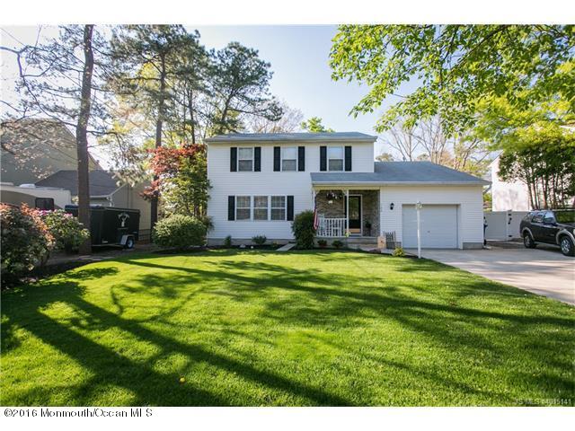 120 Torpedo Road Manahawkin, NJ 08050 - Photo 1 of 10 a front view of a house with a garden