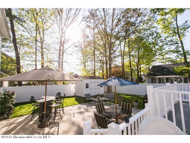 120 Torpedo Road Manahawkin, NJ 08050 - Photo 8 of 10 a view of a house with backyard sitting area and barbeque oven