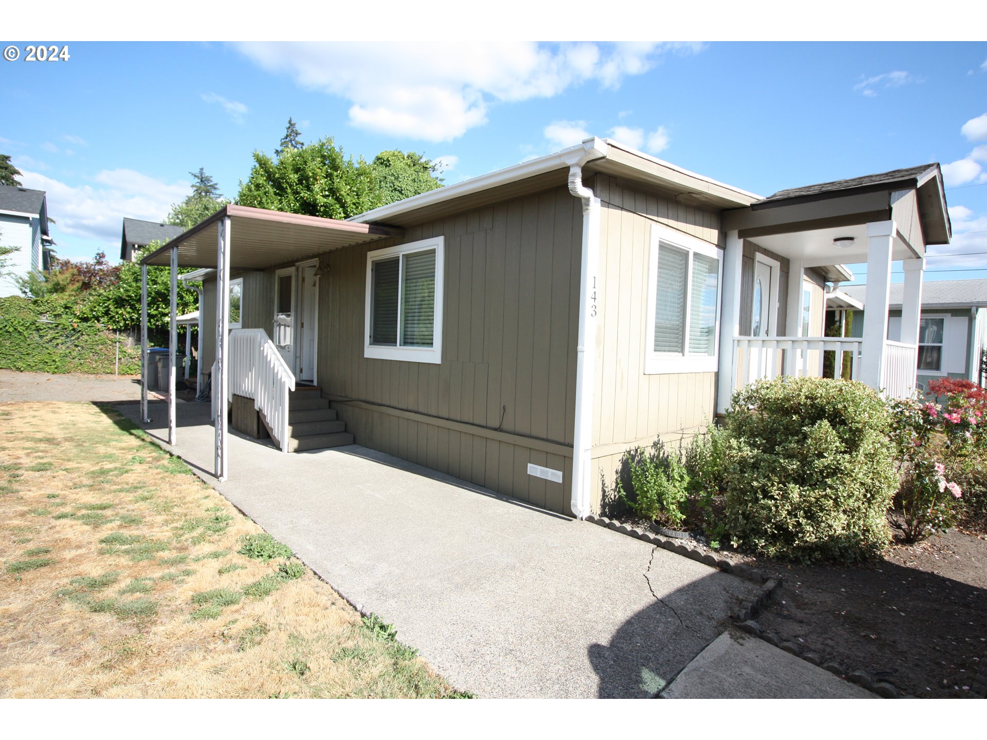 12450 Southwest Fischer Road, Unit 143 Portland, OR 97224 - Photo 6 of 11 a house view with a outdoor space