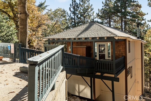 1215 Scenic Way Rimforest, CA 92378 - Photo 1 of 1 a view of a house with wooden fence next to a yard