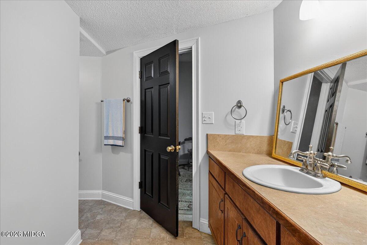 518 River Overlook Forsyth, GA 31029 - Photo 48 of 96 a bathroom with a sink and a mirror