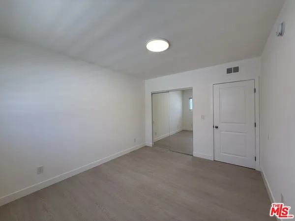 an empty room with a empty space and window