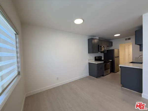 a view of a kitchen with a sink