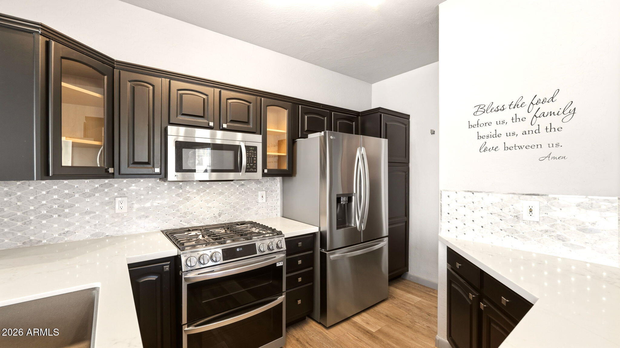 9065 East Gary Road, Unit 126 Scottsdale, AZ 85260 - Photo 14 of 37 a kitchen with stainless steel appliances granite countertop a refrigerator stove and sink