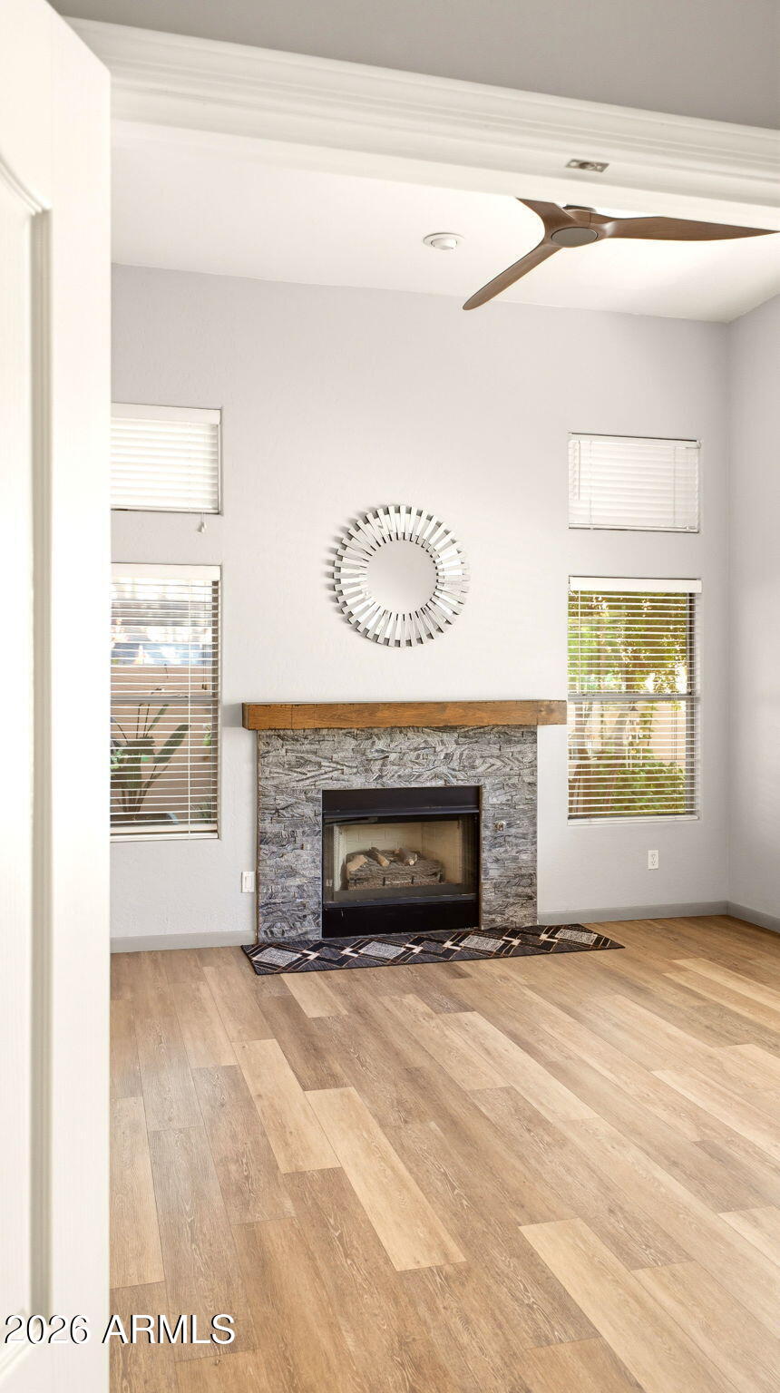 9065 East Gary Road, Unit 126 Scottsdale, AZ 85260 - Photo 17 of 37 a view of an empty room with a fireplace and a window