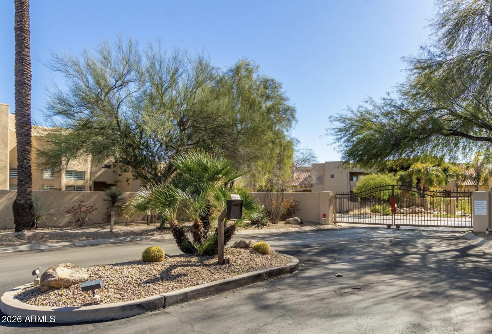 9065 East Gary Road, Unit 126 Scottsdale, AZ 85260 - Photo 2 of 37 a view of a backyard