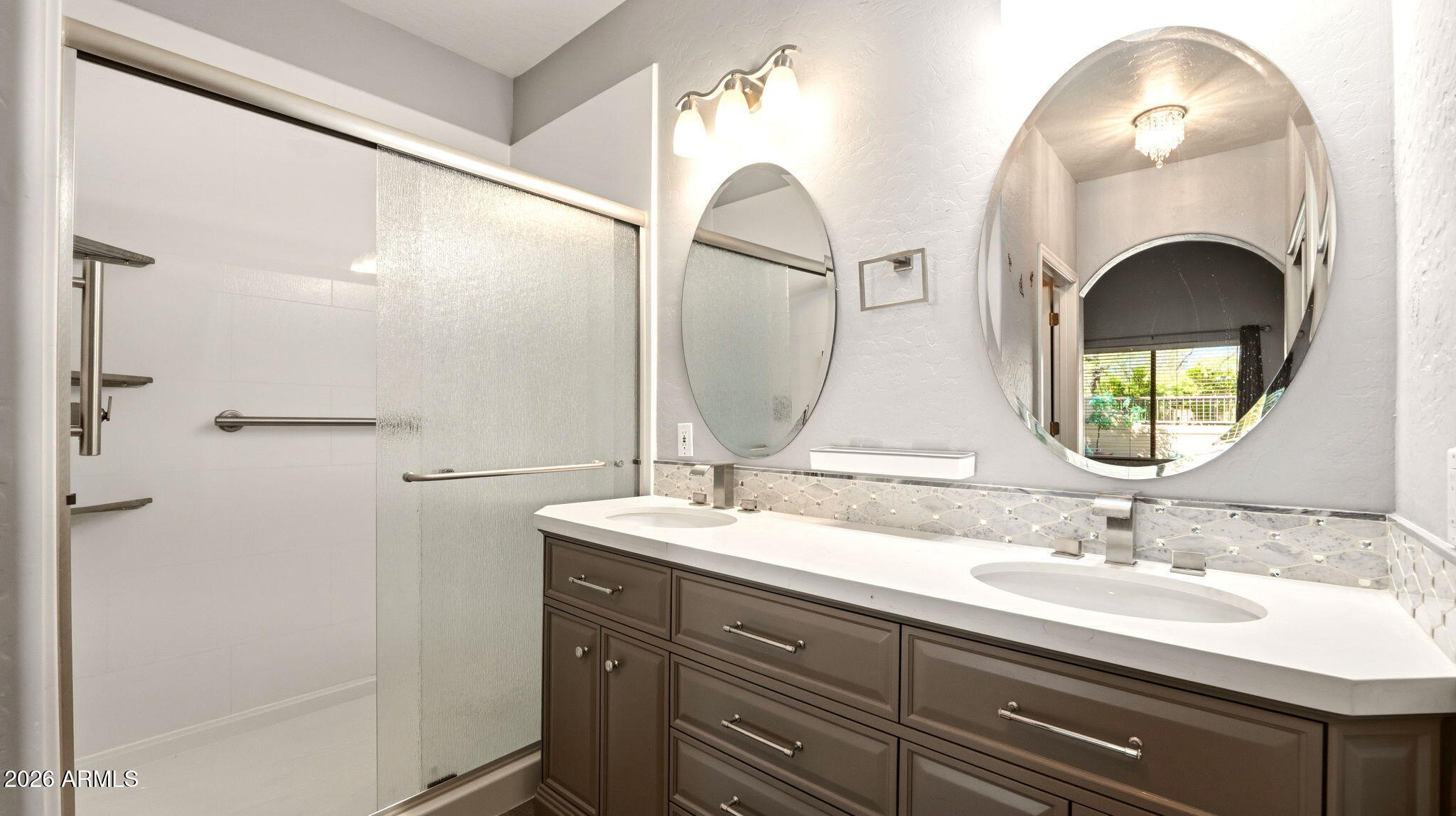 9065 East Gary Road, Unit 126 Scottsdale, AZ 85260 - Photo 21 of 37 a bathroom with a double vanity sink and a mirror
