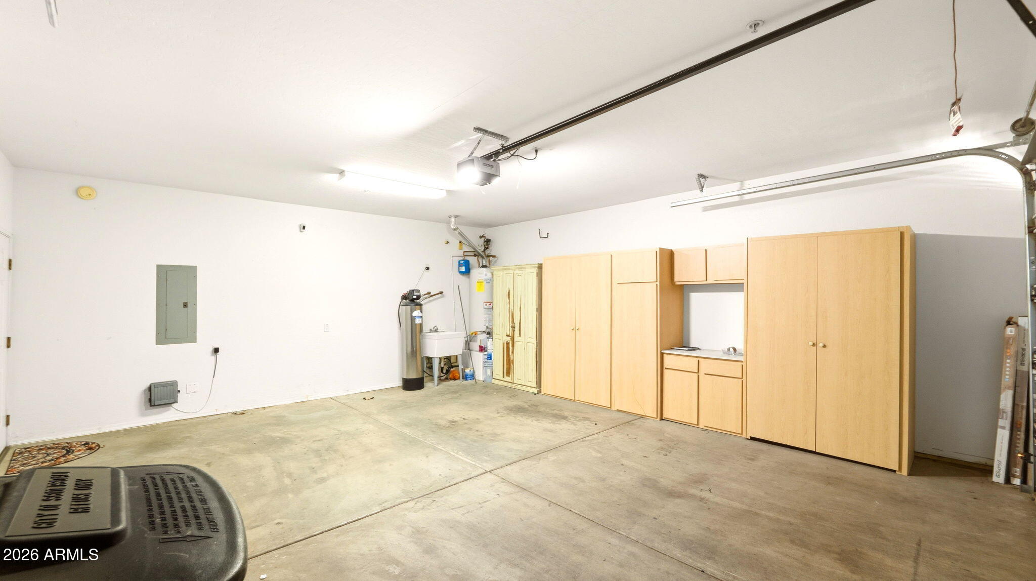 9065 East Gary Road, Unit 126 Scottsdale, AZ 85260 - Photo 26 of 37 a spacious bedroom with a bed and a chandelier