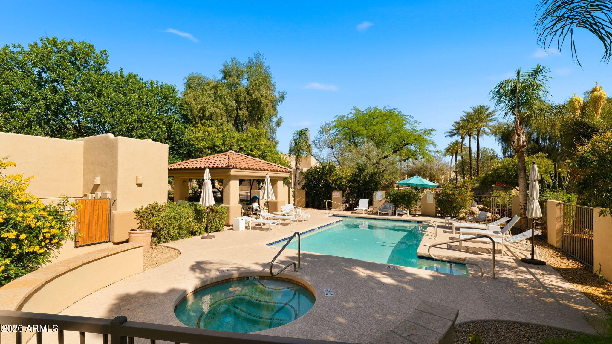 9065 East Gary Road, Unit 126 Scottsdale, AZ 85260 - Photo 32 of 37 a view of a swimming pool with a patio