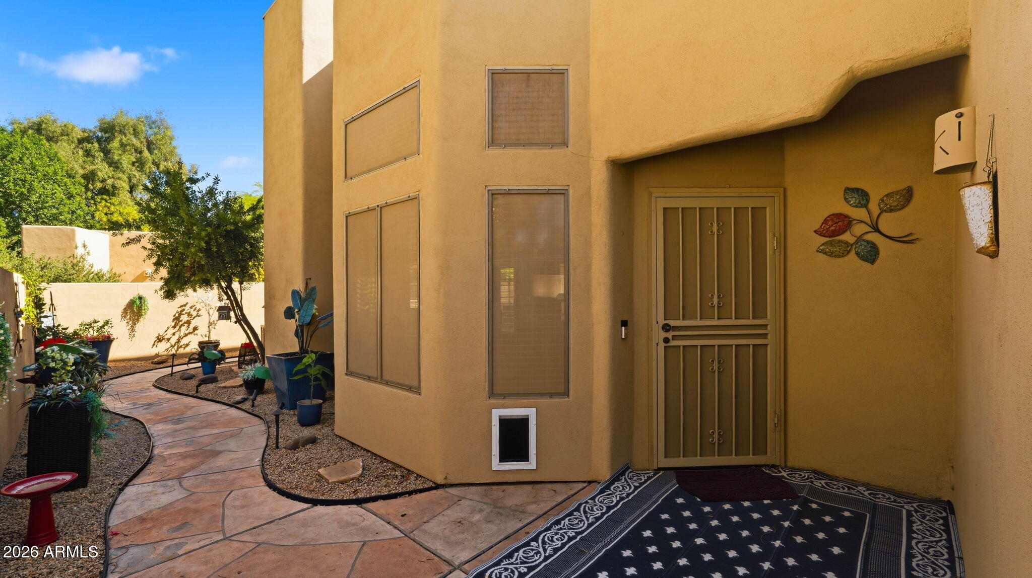 9065 East Gary Road, Unit 126 Scottsdale, AZ 85260 - Photo 4 of 37 a view of a door and chair