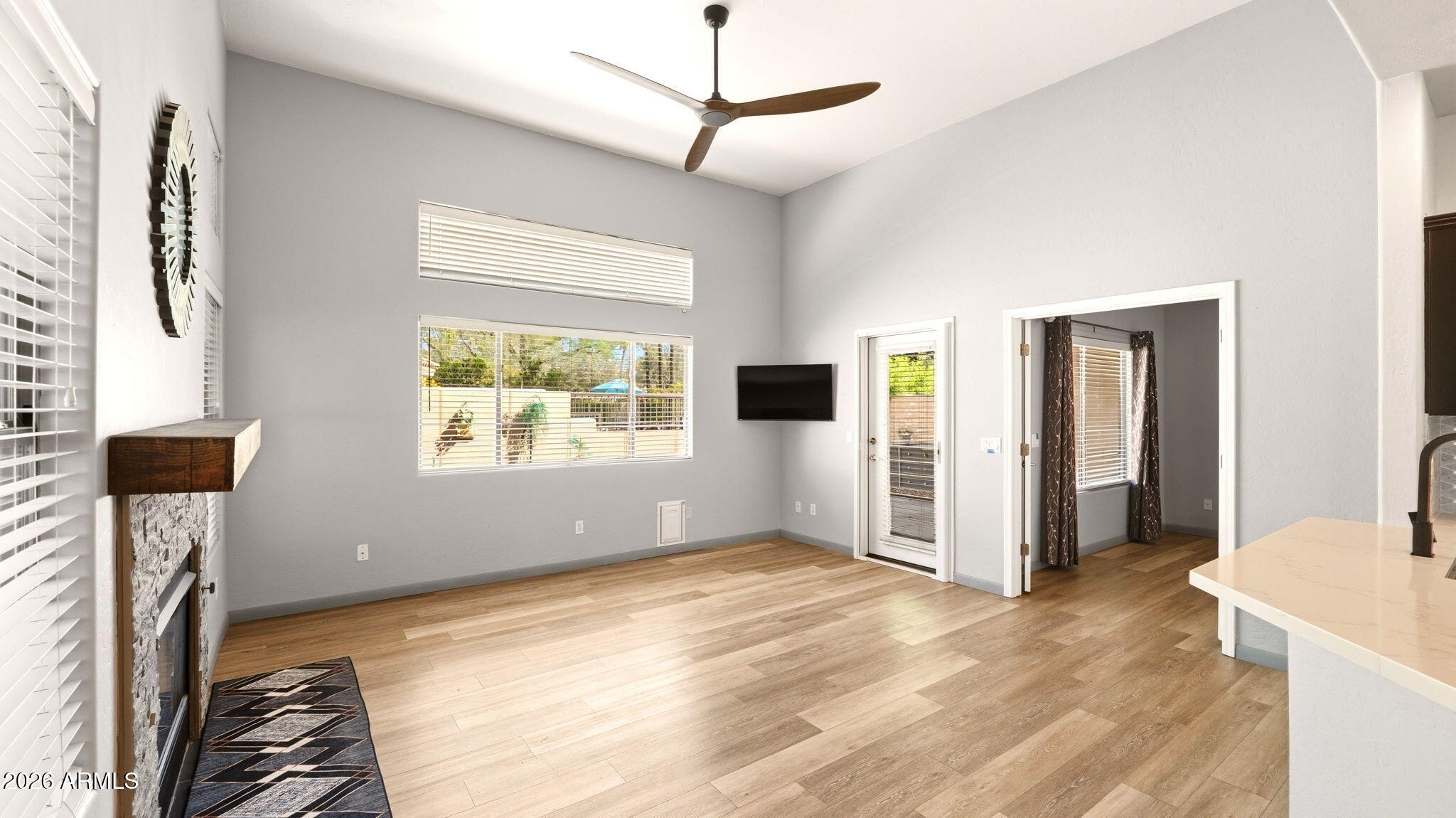 9065 East Gary Road, Unit 126 Scottsdale, AZ 85260 - Photo 7 of 37 a view of a livingroom with wooden floor and a window
