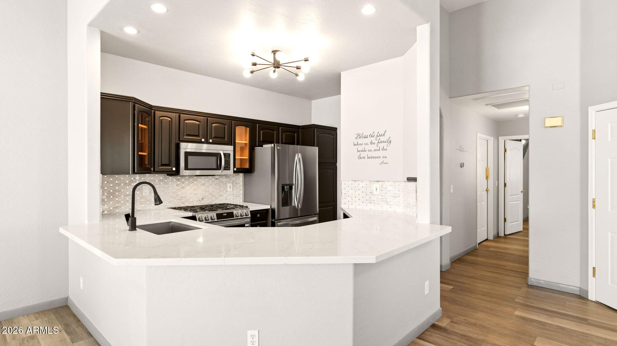 9065 East Gary Road, Unit 126 Scottsdale, AZ 85260 - Photo 10 of 37 a kitchen with stainless steel appliances granite countertop a sink and a refrigerator