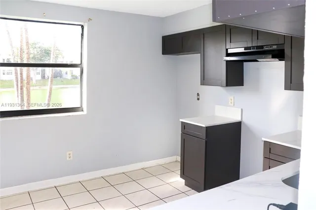 a kitchen with stainless steel appliances a refrigerator and a sink