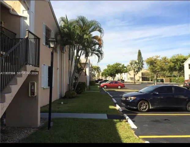 a view of a swimming pool with a yard
