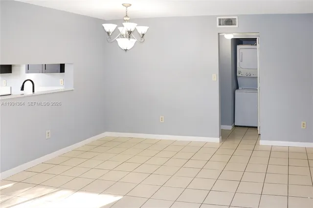 a view of an empty room with a sink