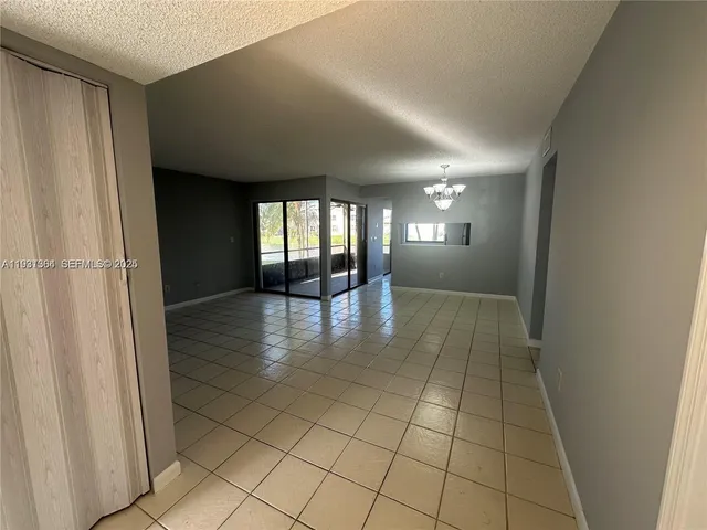 a view of a hallway with a bathroom