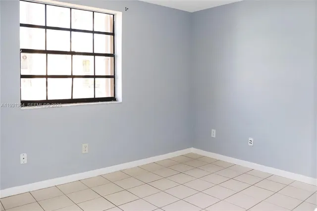 wooden floor and window in an empty room