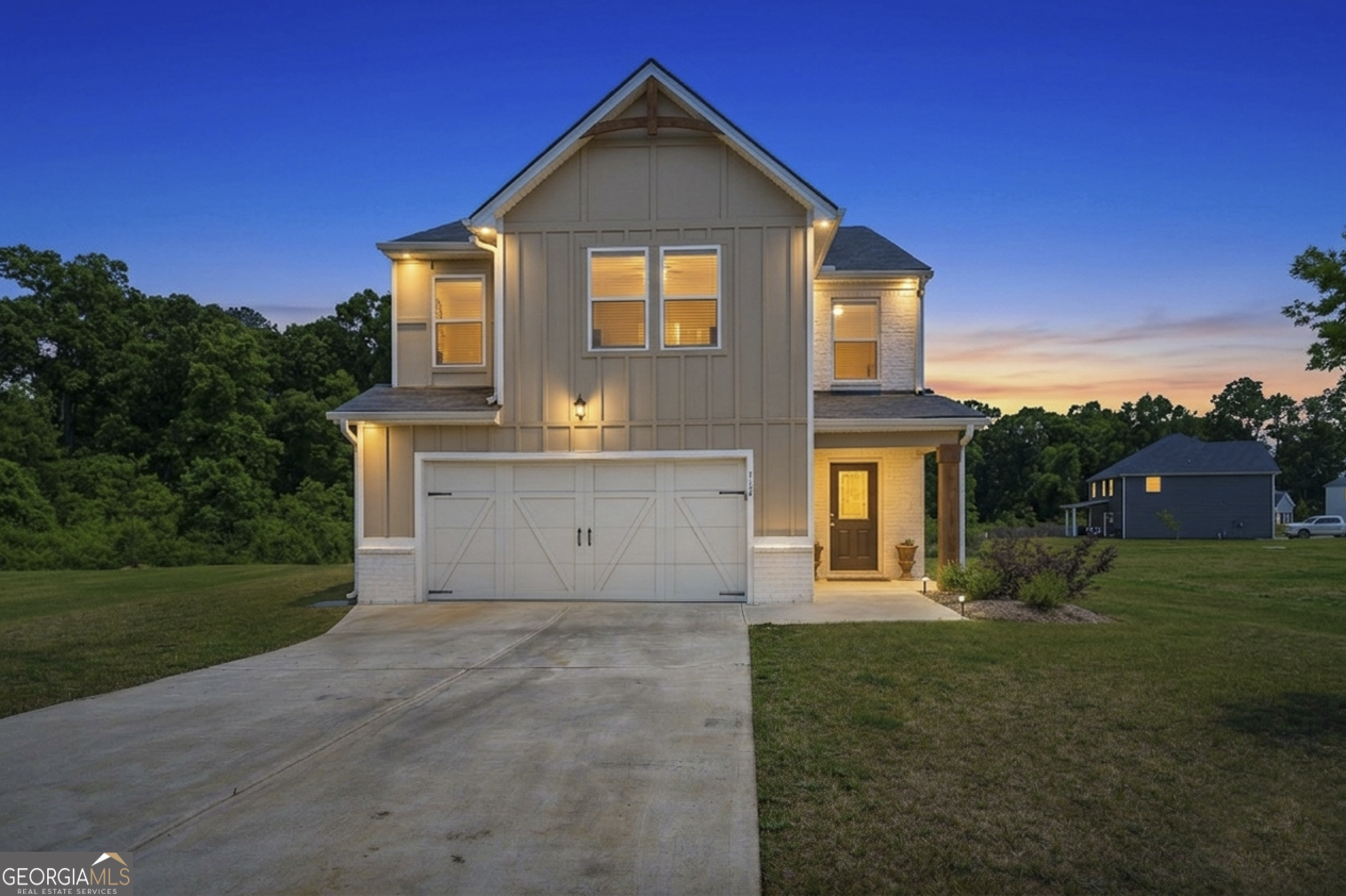 110 Red Barn Court Perry, GA 31069 - Photo 1 of 8 a front view of a house with a yard and garage