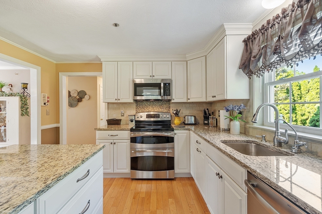 2 Oak Hill Road Haverhill, MA 01830 - Photo 16 of 42 a kitchen with granite countertop a sink stainless steel appliances and cabinets
