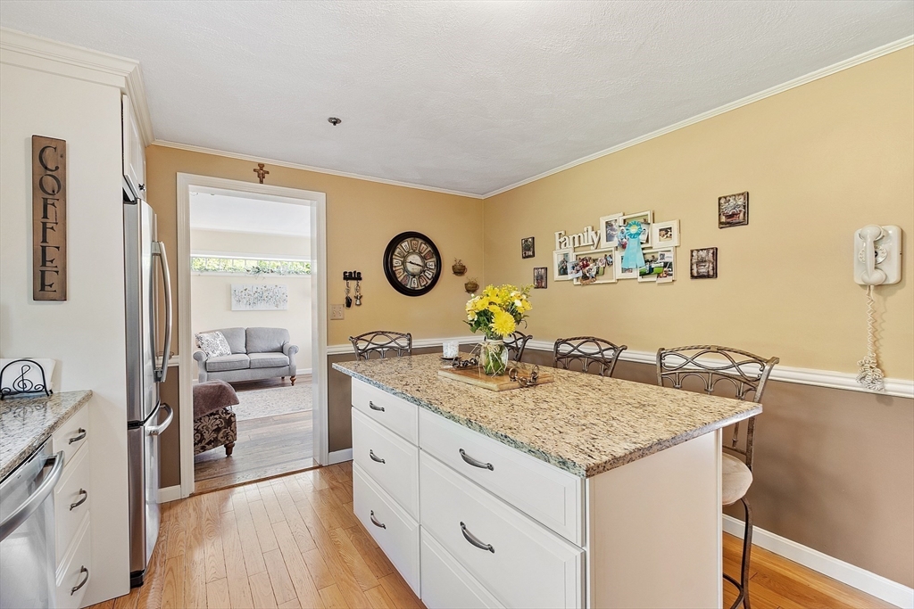 2 Oak Hill Road Haverhill, MA 01830 - Photo 17 of 42 a view of a kitchen area with furniture and wooden floor