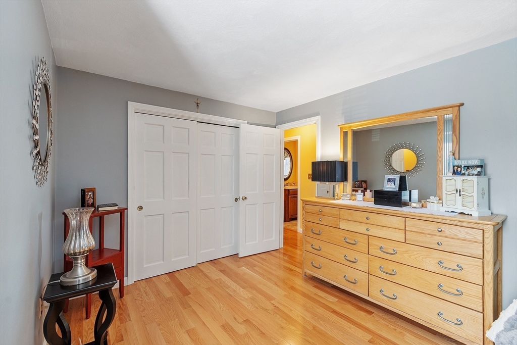2 Oak Hill Road Haverhill, MA 01830 - Photo 28 of 42 a bedroom with a large bed and a dresser in it