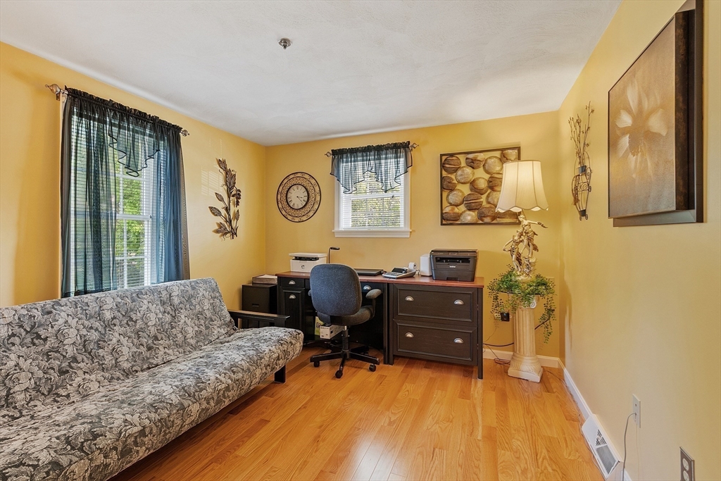 2 Oak Hill Road Haverhill, MA 01830 - Photo 32 of 42 a bedroom with a bed and wooden floor