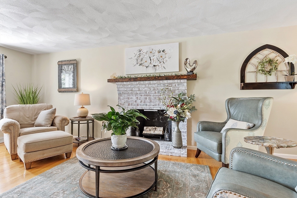 2 Oak Hill Road Haverhill, MA 01830 - Photo 7 of 42 a living room with furniture a couch and a potted plant