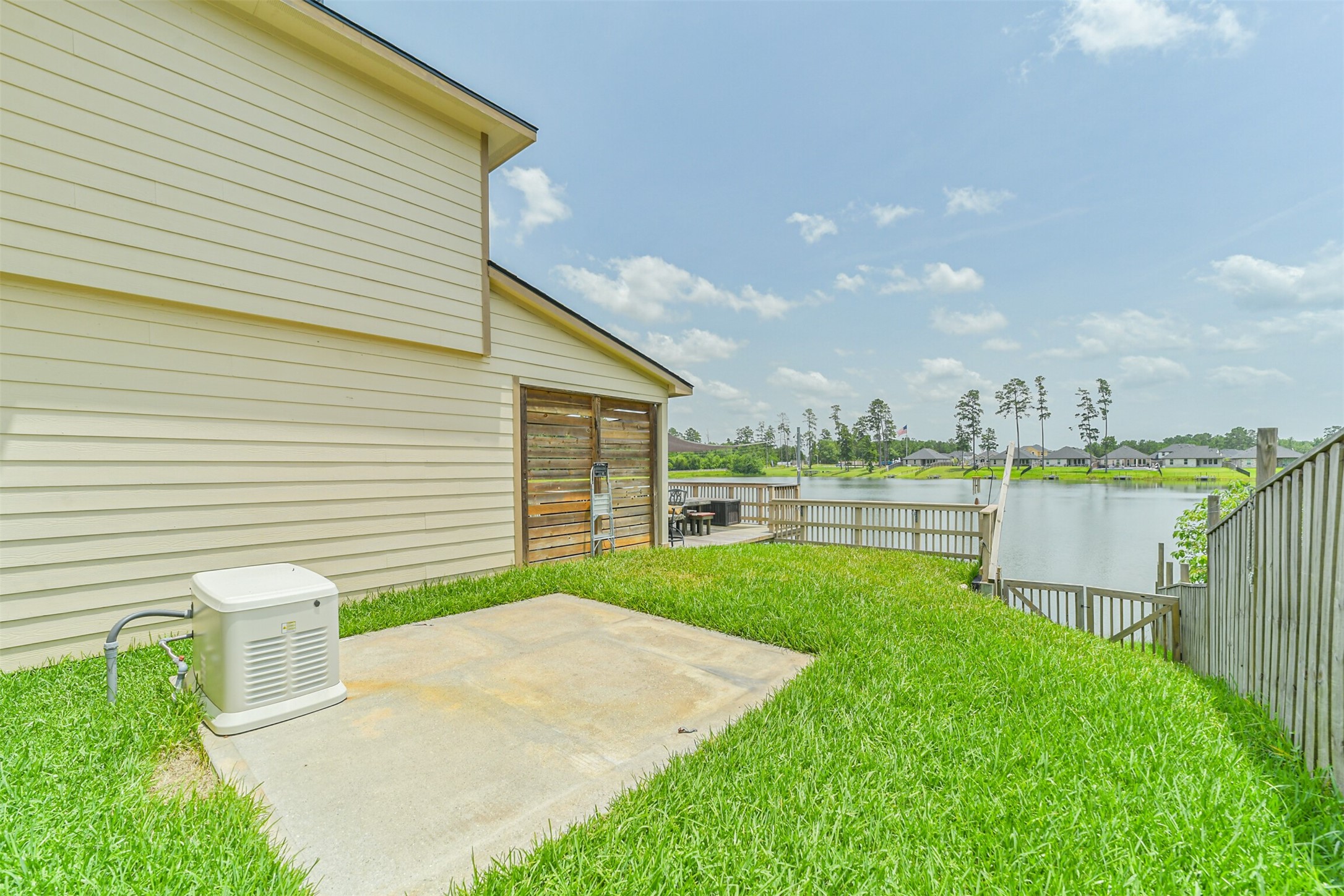 12009 La Salle River Road Conroe, TX 77304 - Photo 44 of 50 a view of a backyard with table and chairs and a garden