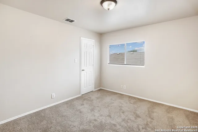 a bathroom with a toilet sink and shower