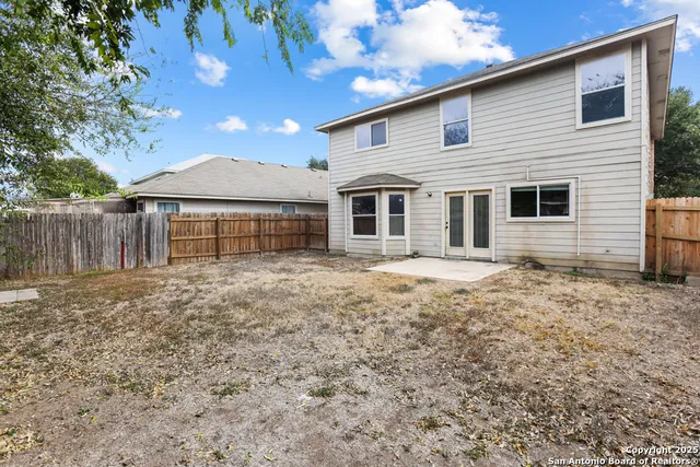 a front view of house with a garden