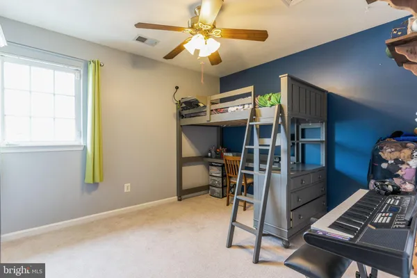 a view of room with furniture and a window