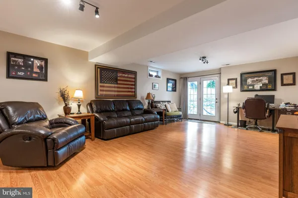 a living room with furniture window and wooden floor