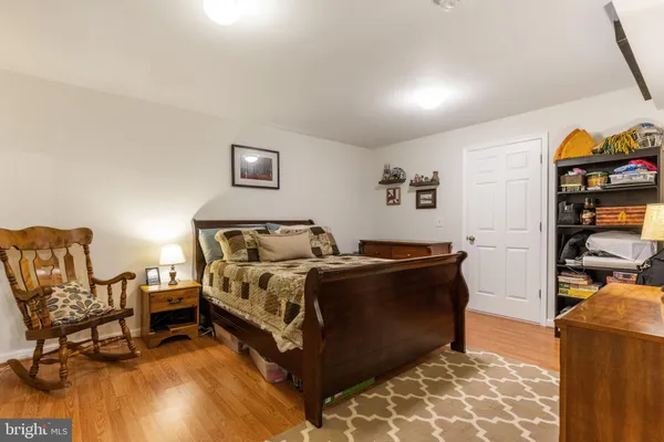 a bed room with a bed and a chair