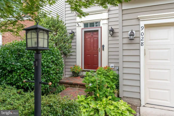 a view of a house with a flower garden
