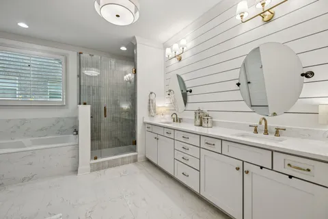 a bathroom with a bathtub and a shower
