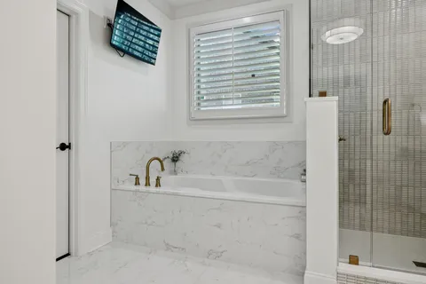 a utility room with sink dryer and washer