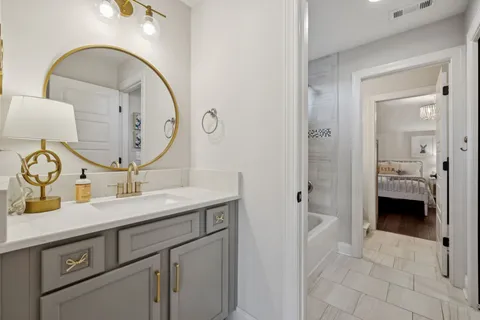 a bathroom with a sink and a mirror