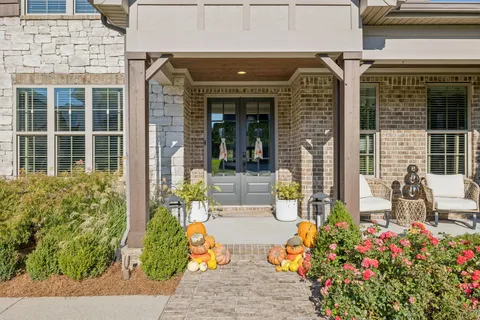 a view of an entryway with wooden floor and windows