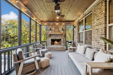 a view of a patio with table and chairs and potted plants