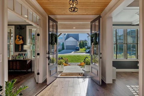 a living room with fireplace furniture and a flat screen tv