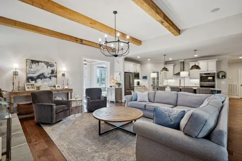 a kitchen with stainless steel appliances granite countertop a stove oven and a refrigerator