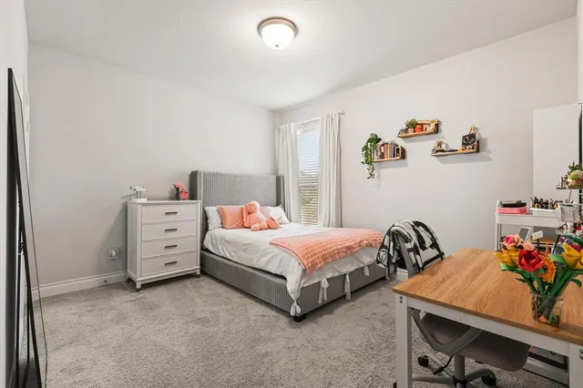 a room with a bed and a desk