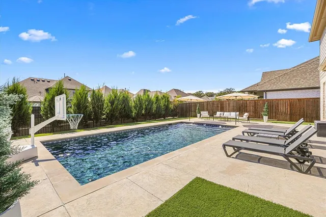 a view of a backyard with sitting area